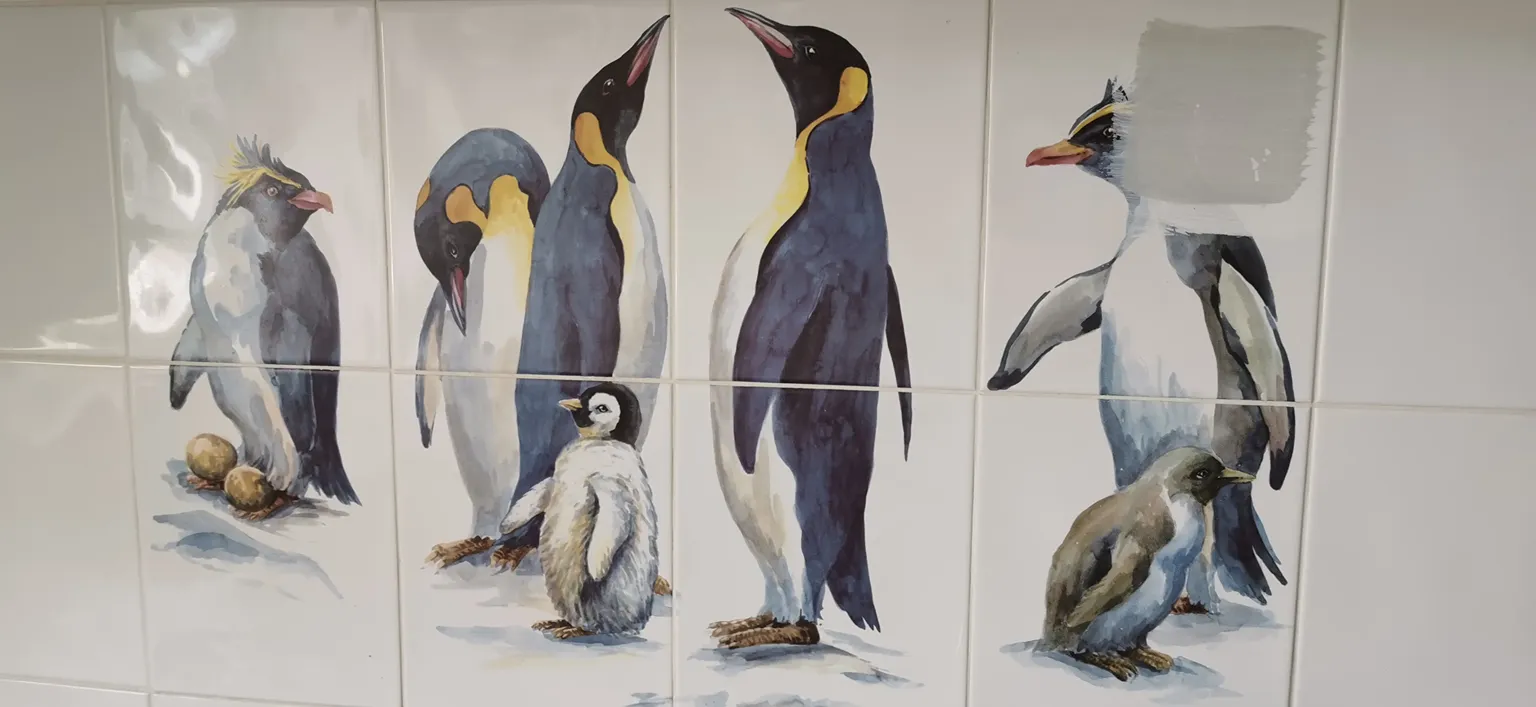 Painted tiles with penguin design